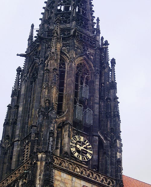 Hanging iron cages in the Lambertikirche tower in Muenster NRW "Hanging iron cages in the Lambertikirche tower in Muenster NRW"